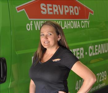 Teresa L. Administrative Assistant SERVPRO West Oklahoma City, female employee in front of green vehicle